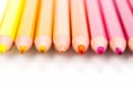 Macro multicolored pencils on a white background