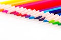 Macro multicolored pencils on a white background