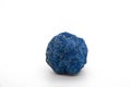 Macro of natural mineral rock specimen of raw azurite stone isolated on a white background. Ore azurite semiprecious geological