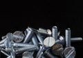Macro Nuts Bolts,Screw, Machine Screw, Countersunk.Amit Scrue on black background,Metal screws for use in sheet metal Royalty Free Stock Photo