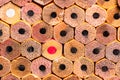 A macro OCD very orderly stack of new #2 unsharpened pencil ends with triggering Red and White colored pencils in the stack Royalty Free Stock Photo