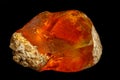 Macro Opal mineral stone in rock on black background Royalty Free Stock Photo