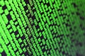 Macro of password selection on the monitor of the office computer. The concept of hacking the protection of a personal data keeper