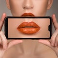 Macro perfect lip makeup. Macro photograph of the details of the face. Lipstick shades of orange.