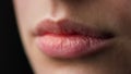 Macro of perfect natural female lips on black background. Plump sexy full lips. Royalty Free Stock Photo