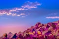 Macro photo of amethyst crystals and sunset sky with clouds