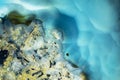 Macro photo of a aqua blue agate rock slice. Royalty Free Stock Photo