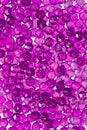 Close up of translucent purple crystals. Purple beads glittering and shining in the light Royalty Free Stock Photo