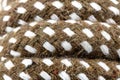 Macro photo of a brown rope with white details made of cotton and jute. Royalty Free Stock Photo