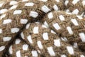 Macro photo of a brown rope with white details made of cotton and jute. Royalty Free Stock Photo