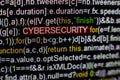Macro photo of computer screen with program source code and highlighted CYBERSECURITY inscription in the middle. Script Royalty Free Stock Photo