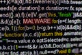 Macro photo of computer screen with program source code and highlighted MALWARE inscription in the middle. Script on the Royalty Free Stock Photo