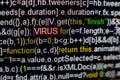 Macro photo of computer screen with program source code and highlighted VIRUS inscription in the middle. Script on the Royalty Free Stock Photo