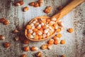 Macro photo of corn grains in wooden spoon and scattered grains on vintage wooden surface