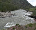 Macro photo with a decorative landscape background of a beautiful perspective of a strong mountain river