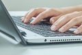 Macro photo of female hands typing on laptop. businesswoman work