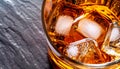 The macro photo of glass with whiskey and ice cubes top view Royalty Free Stock Photo