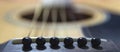 Macro photo of a guitar strings in perspective.