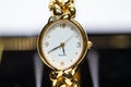 Macro photo of a ladies watch. Clock hands. An antique clock. Old picture. Time signals. Royalty Free Stock Photo