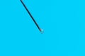 Macro photo of a medical needle from a syringe on a blue background. The concept of vaccination in health care Royalty Free Stock Photo