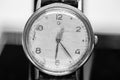 Macro photo of a men`s watch. Clock hands. An antique clock. Black and white photo. Time signals. Royalty Free Stock Photo