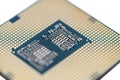 A macro photo of a modern CPU processor under the LGA 1200 socket on a green circuit board, isolated on a white background. Royalty Free Stock Photo