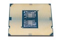 A macro photo of a modern CPU processor under the LGA 1200 socket on a green circuit board, isolated on a white background.