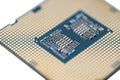 A macro photo of a modern CPU processor under the LGA 1200 socket on a green circuit board, isolated on a white background. Royalty Free Stock Photo