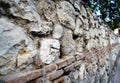 Macro photo of a Mozarabic stone wall with limestone eroded by time and old clay baked brick. very shallow d Royalty Free Stock Photo