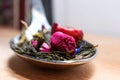 Macro photo of tea with a tea rose. The composition of the heap