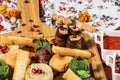 Macro Photo of Traditional Georgian Dish Pkhali or Phali on Wooden tray. Chopped and Minced Cabbage, Eggplant, Spinach, Beans,