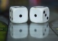 Macro photograhpy to an Old white dices with double one pair