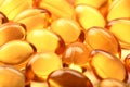 Cod-liver oil macro image of health capsules. Royalty Free Stock Photo