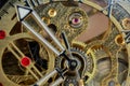 Macro photograph of the internal gears of the machine of a bronze and steel wristwatch. Selective focus