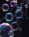 Macro Photograph of Iridescent Soap Bubbles Floating Against a Black Background Royalty Free Stock Photo