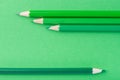 Macro photograph of several pencils of green color on a paper ba Royalty Free Stock Photo