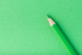 Macro photograph of several pencils of green color on a paper background Royalty Free Stock Photo