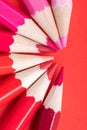 Macro photograph of several pencils of red color on a paper back Royalty Free Stock Photo