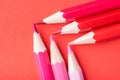 Macro photograph of several pencils of red color on a paper back Royalty Free Stock Photo