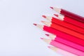 Macro photograph of several pencils of red color on a white back Royalty Free Stock Photo