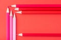 Macro photograph of several pencils of red color on a paper back Royalty Free Stock Photo