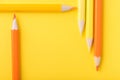 Macro photograph of several pencils of yellow and orange color o Royalty Free Stock Photo