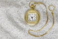 Macro photography of a gold pocket watch on sand Royalty Free Stock Photo