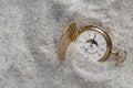 Macro photography of a gold pocket watch on sand Royalty Free Stock Photo