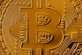 Macro photography of a golden yellow metal bitcoin. Close up shiny metal texture. Abstract business and modern technology backgro Royalty Free Stock Photo