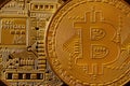 Macro photography of a golden yellow metal bitcoin. Close up shiny metal texture. Abstract business and modern technology backgro Royalty Free Stock Photo