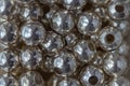 Macro photography of a heap of silver metallic beads Royalty Free Stock Photo