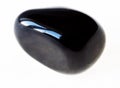 polished black Onyx gem stone on white