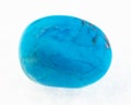 polished blue howlite (turquenite) stone on white