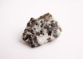 Macro photography of natural mineral from geological collection - raw sphalerite rock on white background